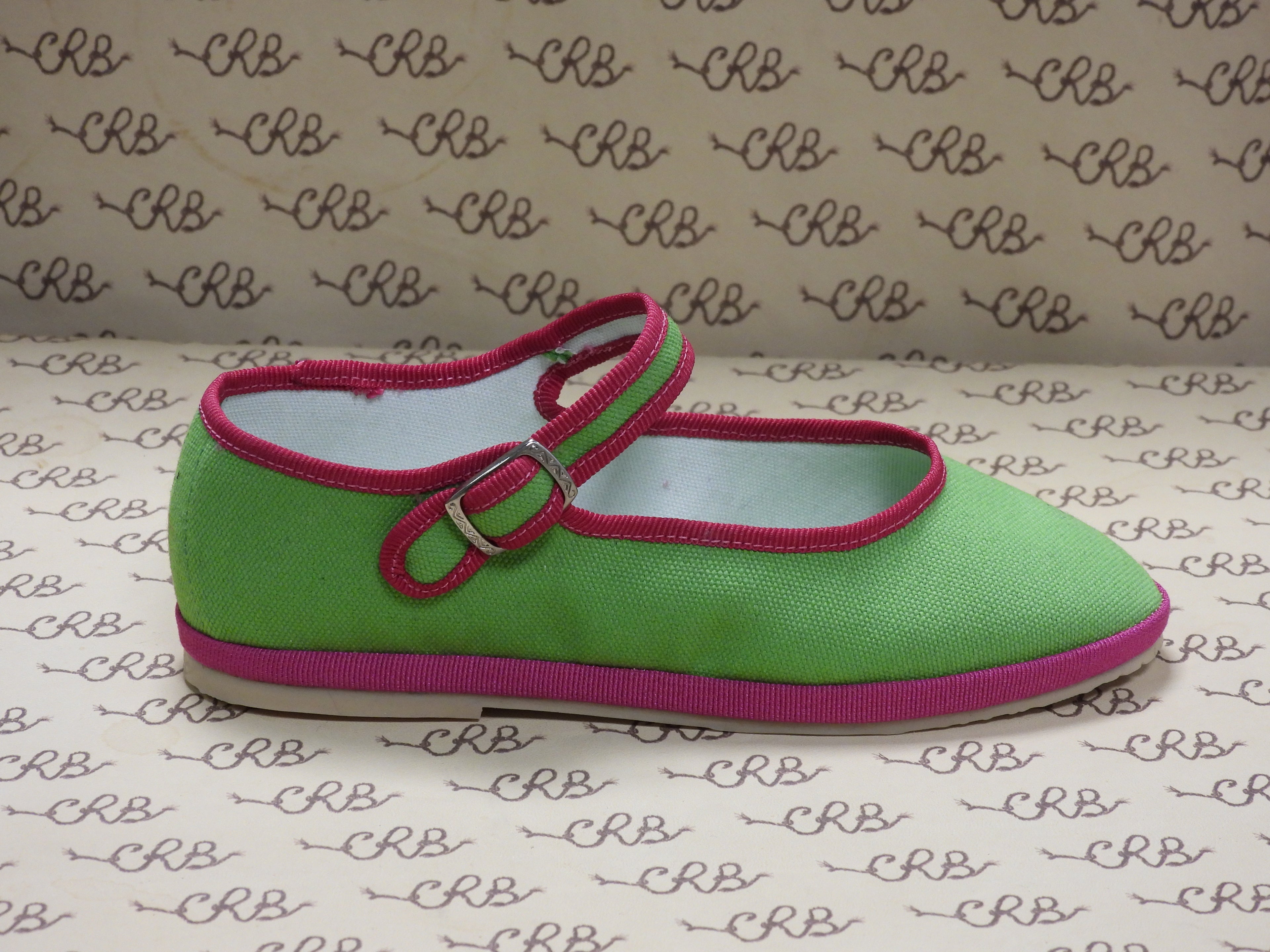 Mary Jane in tessuto olona verde con gros fucsia e fodera bianca